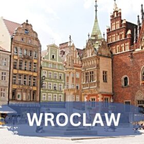 Wroclaw old town square with restaurants and a church